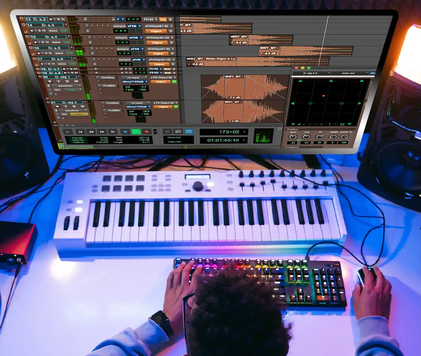 film sound design A professional sound engineer adjusts audio levels on the mixing console during post-production workflow for film projects.