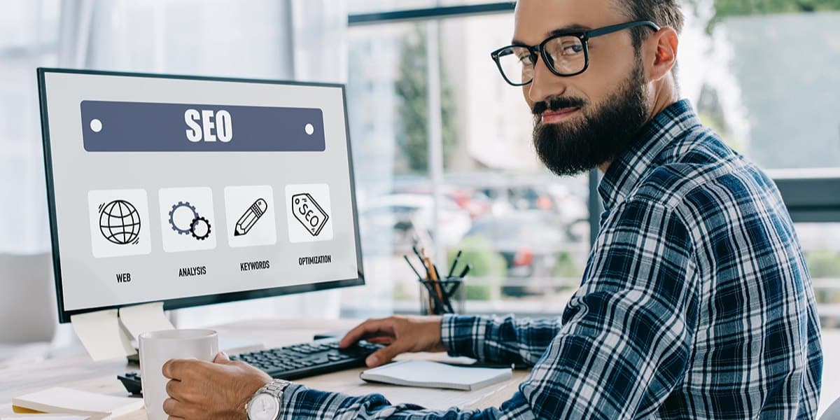 SEO specialist optimizing on-page SEO elements on a desktop computer
