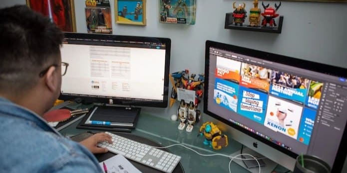 Developer reviewing technical SEO site performance across multiple monitors